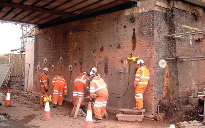 Burton Road Bridge, Whittington, Staffordshire 050 - enhanced Workers installing earth anchors on railway bridge abutment