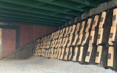 Case Study - I-278 Bridge Rehabilitation 05 Wooden sleepers and metal load plates connected to platipus anchors underneath a highway bridge