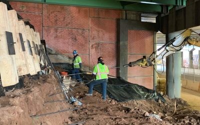 Case Study - I-278 Bridge Rehabilitation 06 Platipus Earth Anchors being driven into a cut face slope underneath a highway bridge