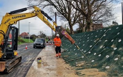 Rattle Road, Stone Cross 50 Excavator driving a Platipus Earth Anchor being used to stabilise a slope