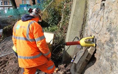 Front 02 Inset earth anchor being load locked against a retaining wall
