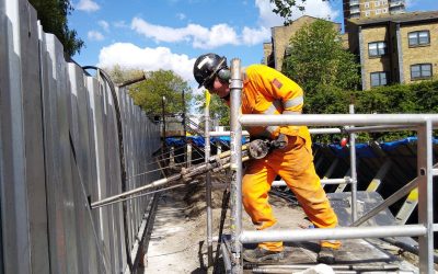 6.Anchor Installation-hand held worker driving an earth anchor through sheet piling