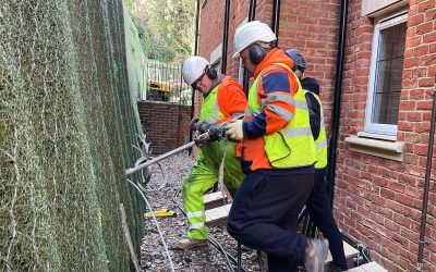 Hill View, Dorking - 24 - Enhanced_result Workers driving earth anchor into timber crib wall