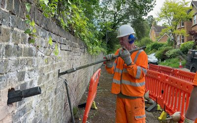 Linkfield Street, Redhill - 32 - Enhanced Worker driving earth anchor through brick retaining wall