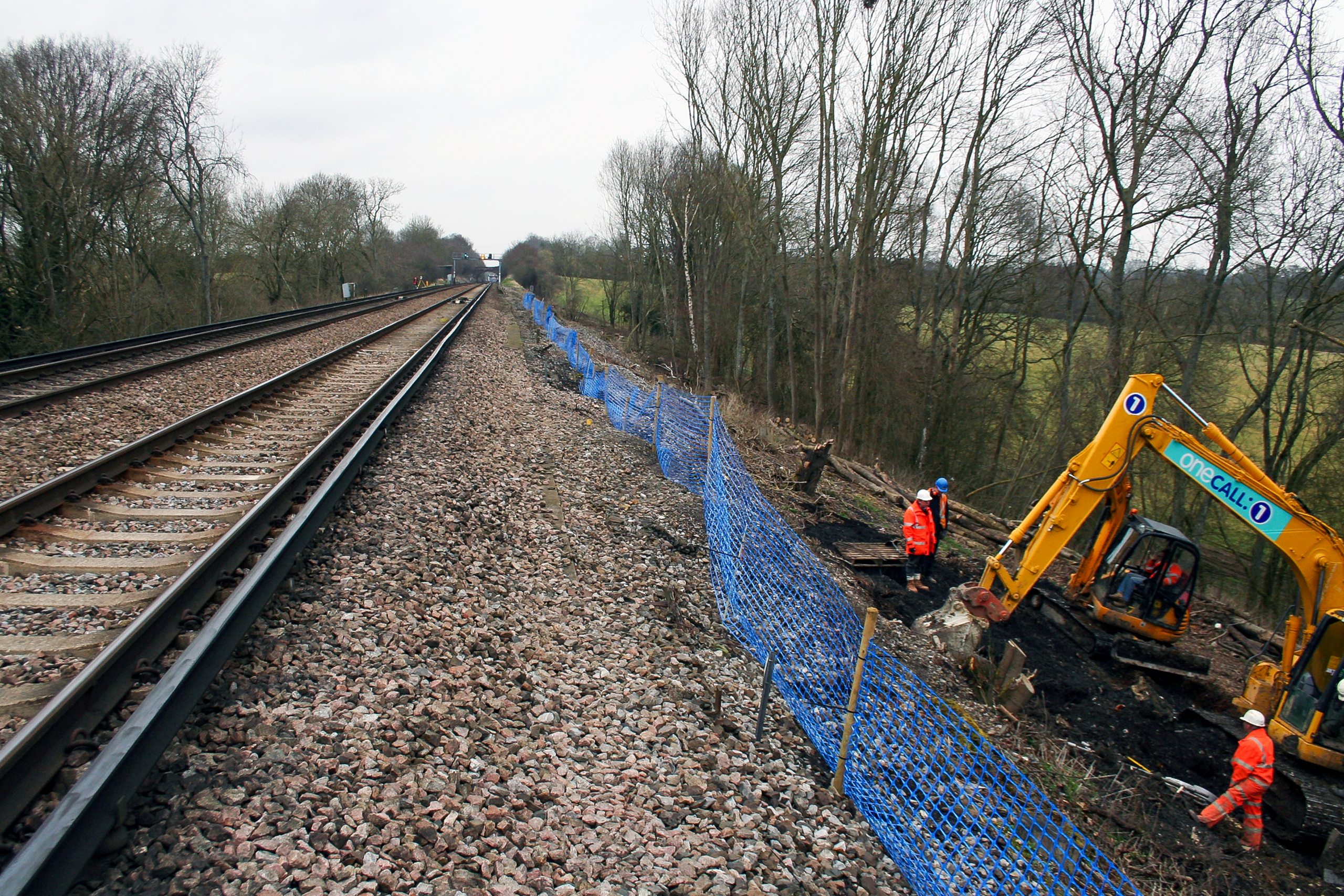 Burgess Hill Embankment Strengthening 052 - Enhanced Plati-Drain being installed to alleviate pore water pressure from railway embankment